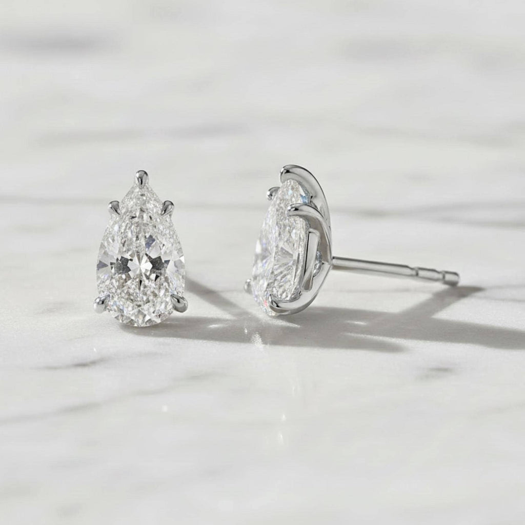 5 Carat Pear Cut Moissanite Diamond Stud Earrings: 14K Yellow Gold