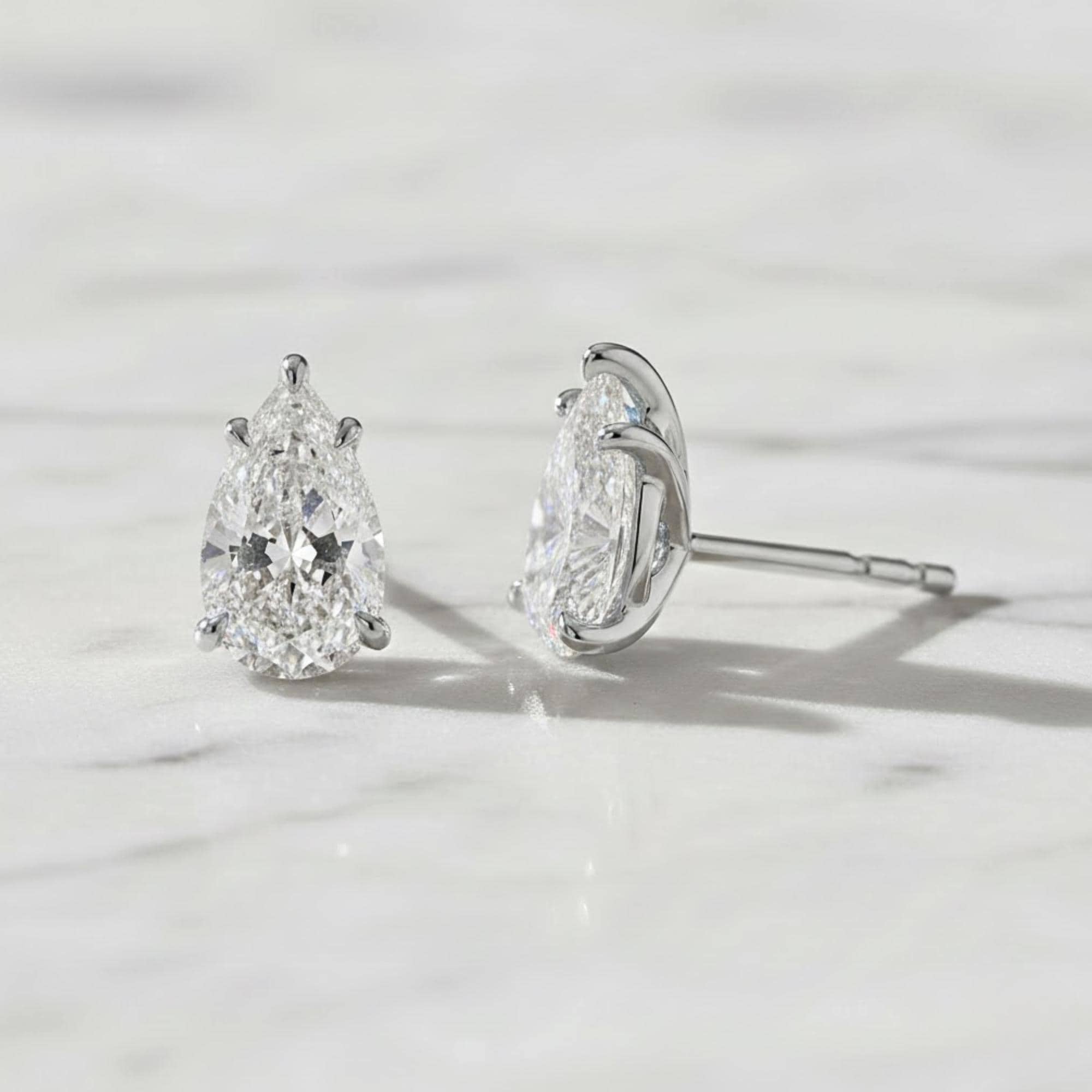 5 Carat Pear Cut Moissanite Diamond Stud Earrings: 14K Yellow Gold