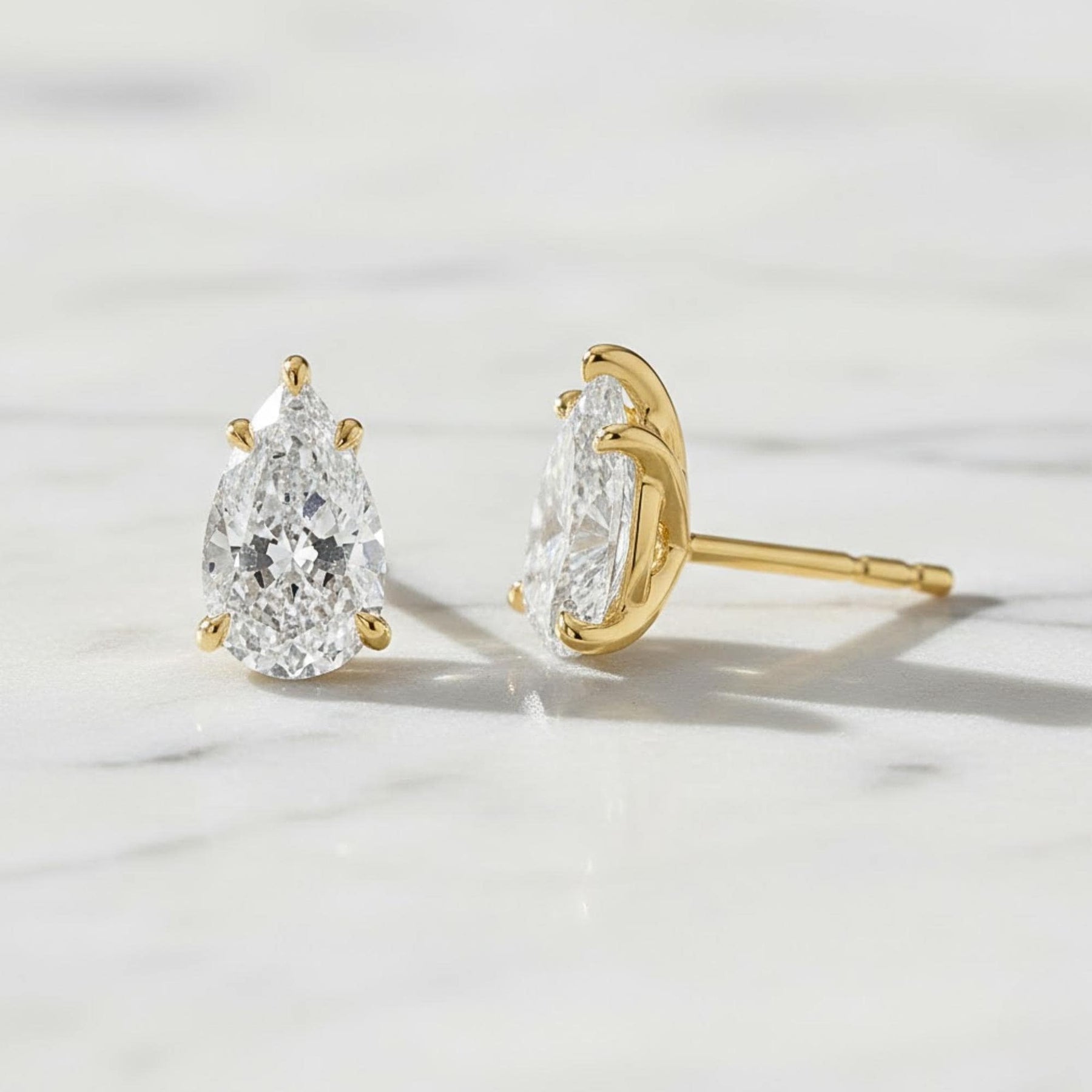 5 Carat Pear Cut Moissanite Diamond Stud Earrings: 14K Yellow Gold